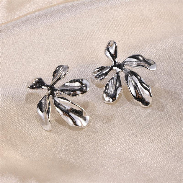 Fashion Metal Flower Earrings For Women
 Product information:
 
 Treatment Process: Electroplating
 
 Color: gold, silver
 
 Applicable population: Female
 
 Material: Alloy
 
 Size: adjustable opening


ESAAS Merch DesignDesigns by SAASFashion Metal Flower Earrings