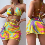 Groovy Swirl Halter Bikini with Matching Skirt - Retro-Inspired Vivid Ignite your poolside presence with the Groovy Swirl Halter Bikini and Matching Skirt set, a tribute to retro charm with a bold, modern twist. This eye-catching ensemDesigns by SAASDesigns by SAASGroovy Swirl Halter Bikini