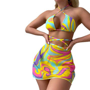 Groovy Swirl Halter Bikini with Matching Skirt - Retro-Inspired Vivid Ignite your poolside presence with the Groovy Swirl Halter Bikini and Matching Skirt set, a tribute to retro charm with a bold, modern twist. This eye-catching ensemDesigns by SAASDesigns by SAASGroovy Swirl Halter Bikini