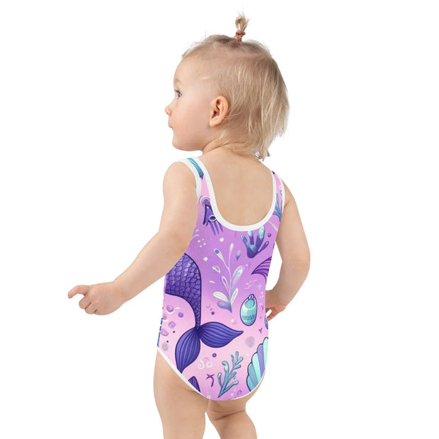 Girls' Magical Mermaid One-Piece Swimsuit - Purple Fantasy Swimwear wiDive into a sea of enchantment with our Girls' Magical Mermaid One-Piece Swimsuit! This delightful swimwear, perfect for young ocean lovers, features a whimsical merDesigns by SAASDesigns by SAAS-Piece Swimsuit - Purple Fantasy Swimwear
