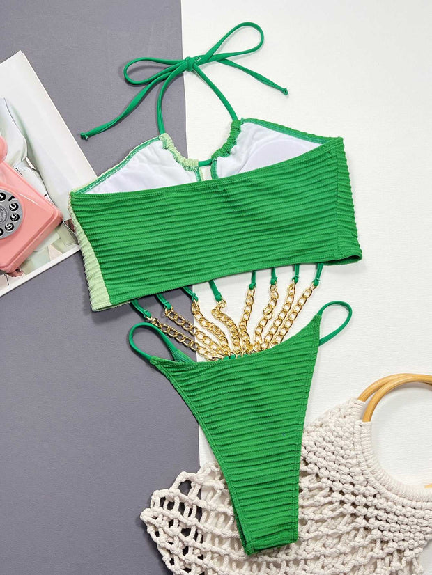 Emerald Envy: Luxe Seashell-Inspired Chain-Link MonokiniUnveil your daring side with our "Emerald Envy Monokini," a masterpiece crafted for the fearless fashionista ready to make a statement. This luxurious one-piece swimDesigns by SAASDesigns by SAASEmerald Envy