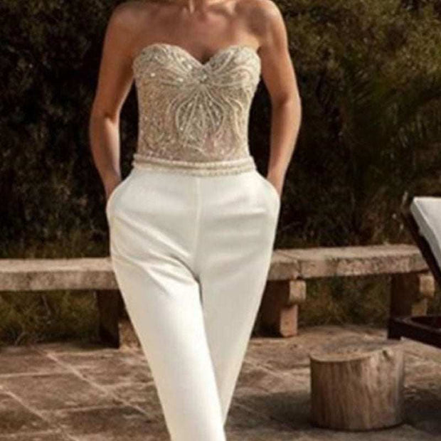Embellished Gold Bustier Top with White High-Waisted Trousers | Glamor- Exquisite gold bustier top adorned with intricate beadwork and sequin embellishments.
- Features a sweetheart neckline to flatter and highlight the décolletage.
- JSAAS Merch DesignDesigns by SAASEmbellished Gold Bustier Top