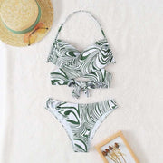 Jungle Rhythm: Swirl-Patterned Twist-Front Bikini Set with Ring AccentDive into the exotic appeal of our "Jungle Rhythm Bikini Set," a swimwear piece that marries the untamed spirit of the wild with the finesse of modern design. This tDesigns by SAASDesigns by SAASJungle Rhythm