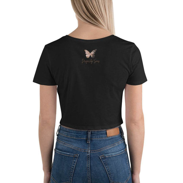 "Women's Lotus Bloom Crop Top Tee - Black Short-Sleeved Graphic T-ShirDiscover the perfect blend of style and serenity with our Women's Lotus Bloom Crop Top Tee. This chic black crop tee showcases a stunning graphic of a lotus flower iDesigns by SAASDesigns by SAAS"Women'
